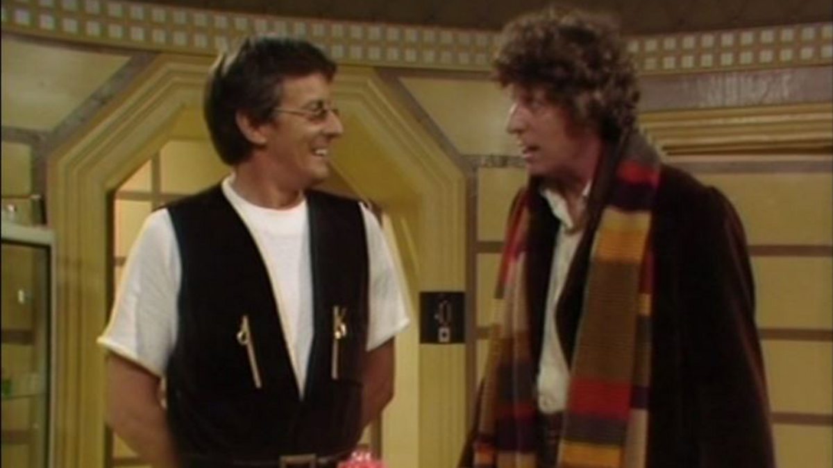 Screencap from Nightmare of Eden: the Doctor looks at Tryst, a scientist in a vest with narrow eyeglasses.