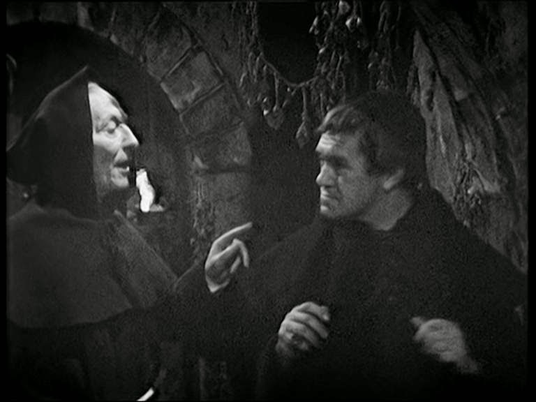 Screencap from The Time Meddler: The Doctor argues with the Monk, both dressed in habits.